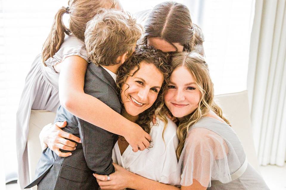 Dressing room wedding hugs