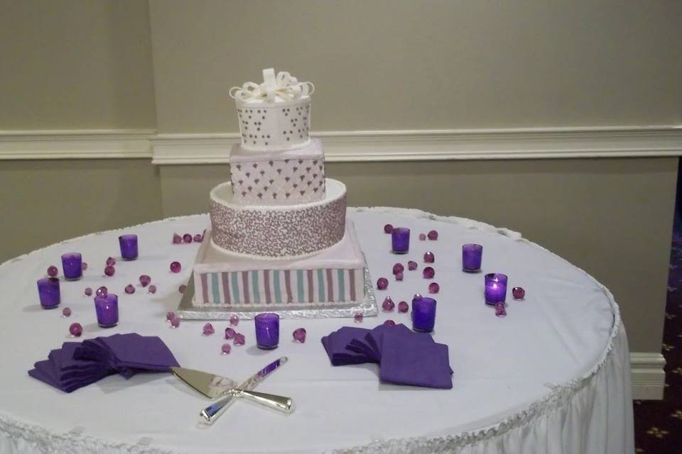 4-tier cake with varying patterns