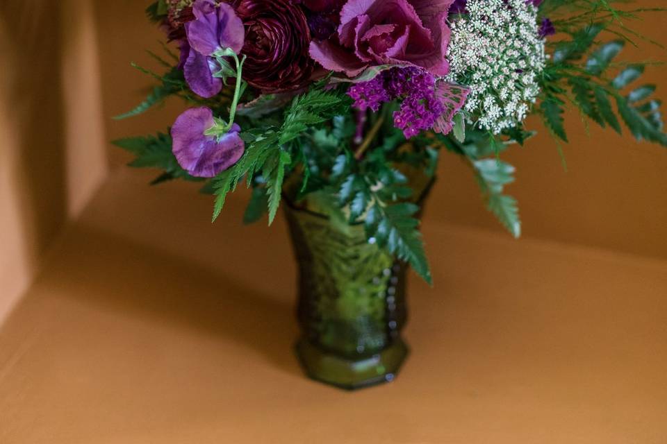 Purple bridal bouquet in vase