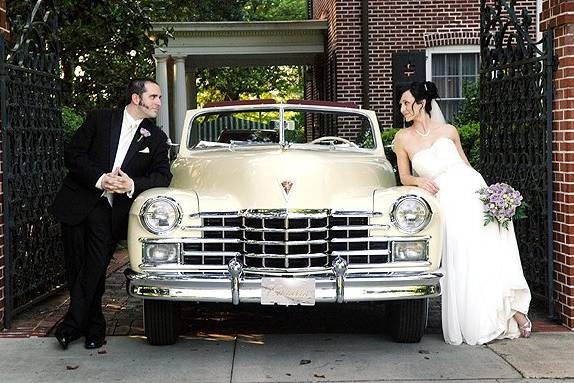 Cadillac convertible with wedding couple