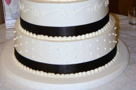 Custom piping to match invitation with sugar flowers