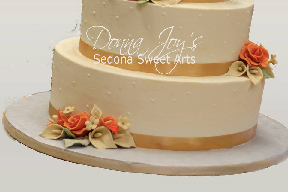 Classic Buttercream Wedding Cake with hand sculpted sugar flowers by Pastry Chef Donna Joy