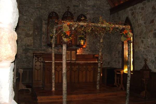 Chuppah made of white birch and autumn flowers