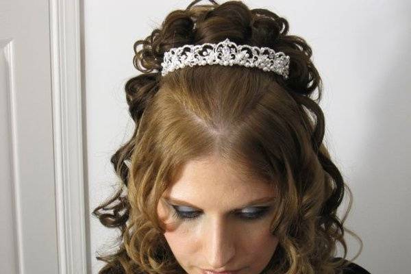 a gorgeous princess-style updo with a beautiful pearl-encrusted tiara
