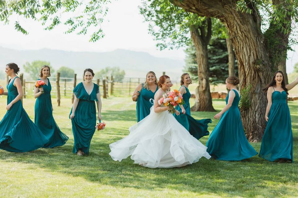 Twirling bride and bridesmaids