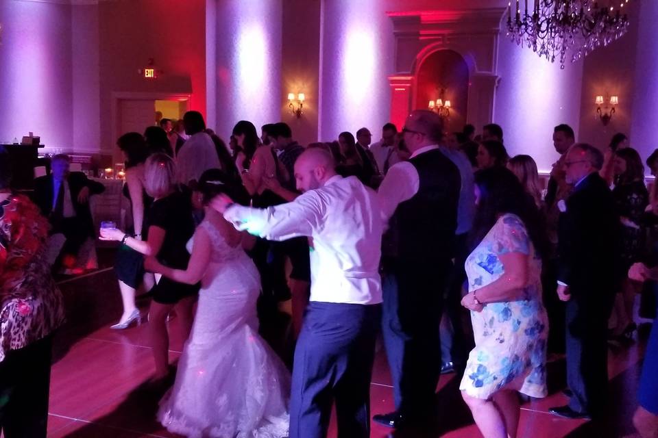 Newlyweds and guests on the dance floor