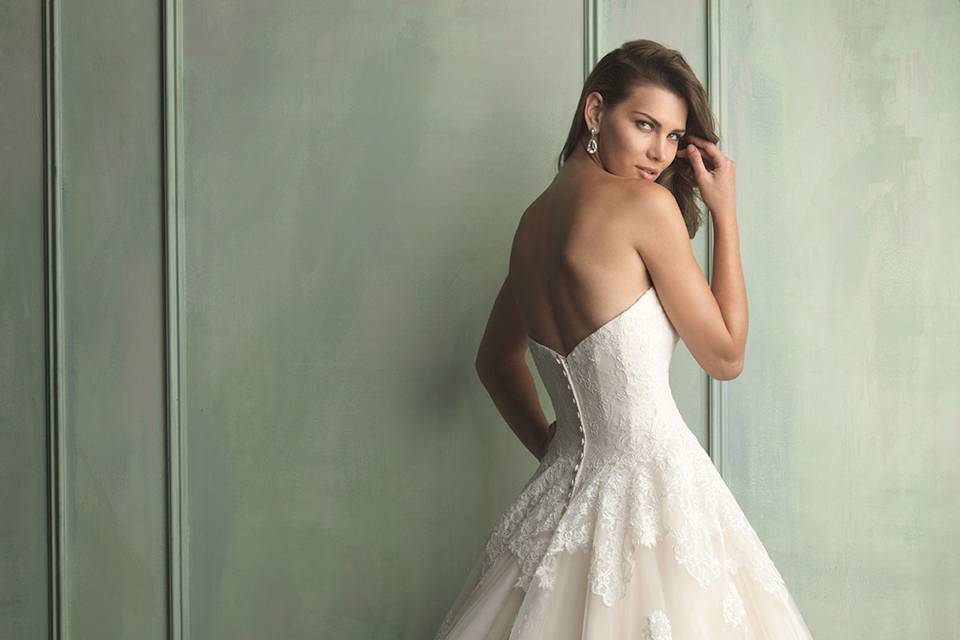 Allure Bridals gown style 9121.  This strapless ballgown features layers of airy English net covered with lace appliqué.