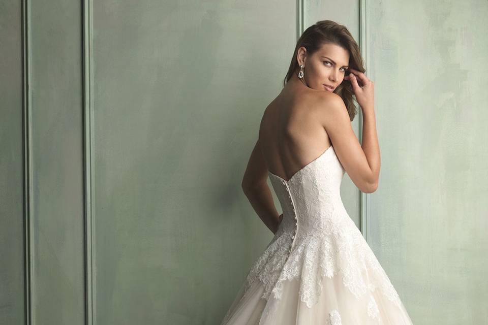 Allure Bridal gown and Tuxedo.  Romantic and classic. This ball gown combines lace and English Net perfectly. The lace bodice features a scoop neckline with cap sleeves while Swarovski crystals accent the waistline.