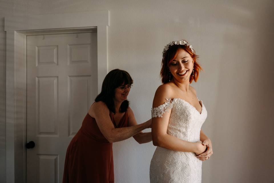 Mom helping bride get ready