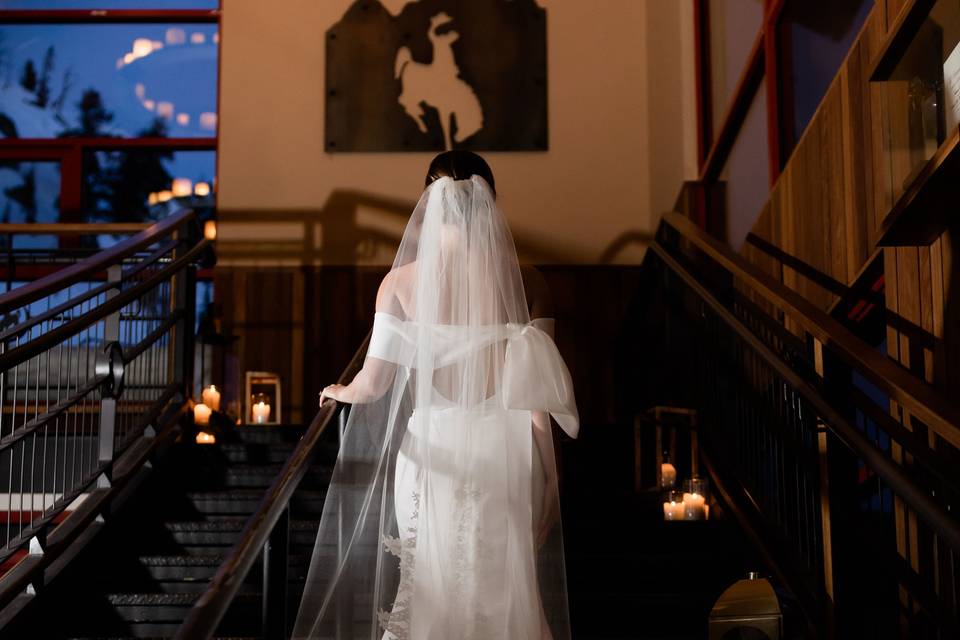Bride gliding up the stairs