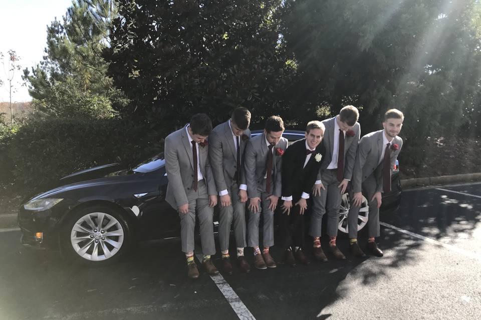 Groomsmen and tesla