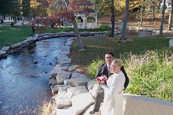 Molly and Norbert pose by the riverside after their wedding ceremony performed by Rev. Misty Urban. Photo copyright 2010 by GRWeddingOfficiant.com