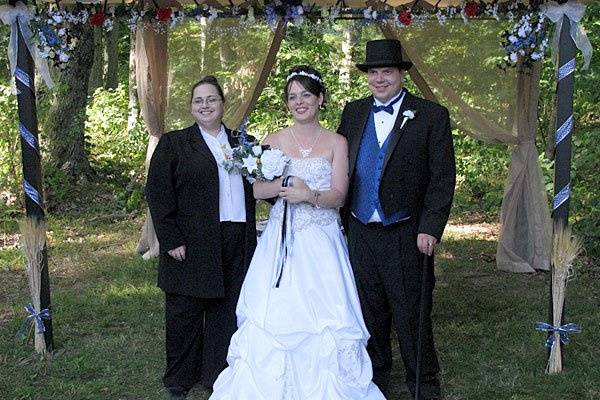 Bill and Theresa pose with Rev. Misty Urban after their handfasting wedding ceremony in the woods. Photo copyright 2009 by GRWeddingOfficiant.com