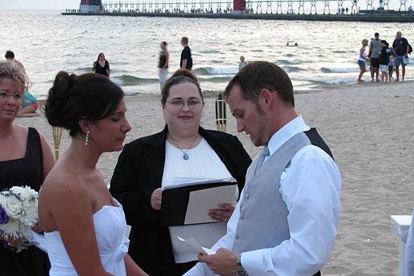 Rev. Misty Urban performs a beach wedding ceremony for Rob and Tricia. Photo copyright 2010 by GRWeddingOfficiant.com