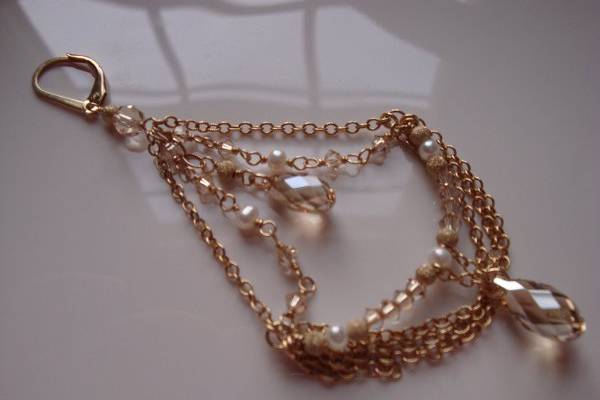 Decadent Chain Chandeliers - Swarovski golden shadow crystals and off white pearls with small stardust gold filled balls and chain...the length is 3 inches from the bottom of the leverback and just over 1 1/2 inches at its widest point...