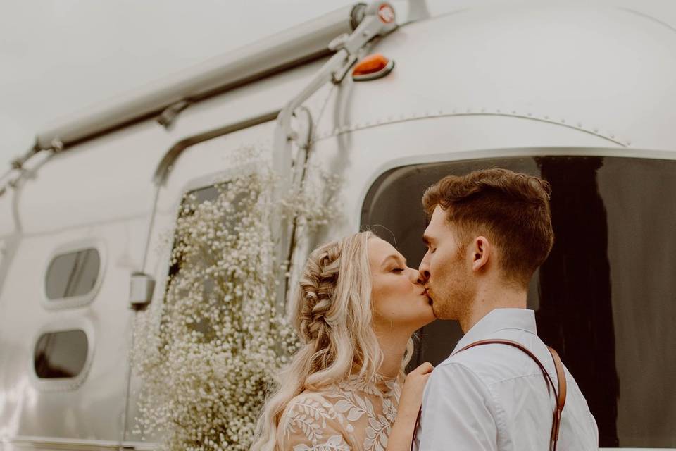 Couple in front of Camper