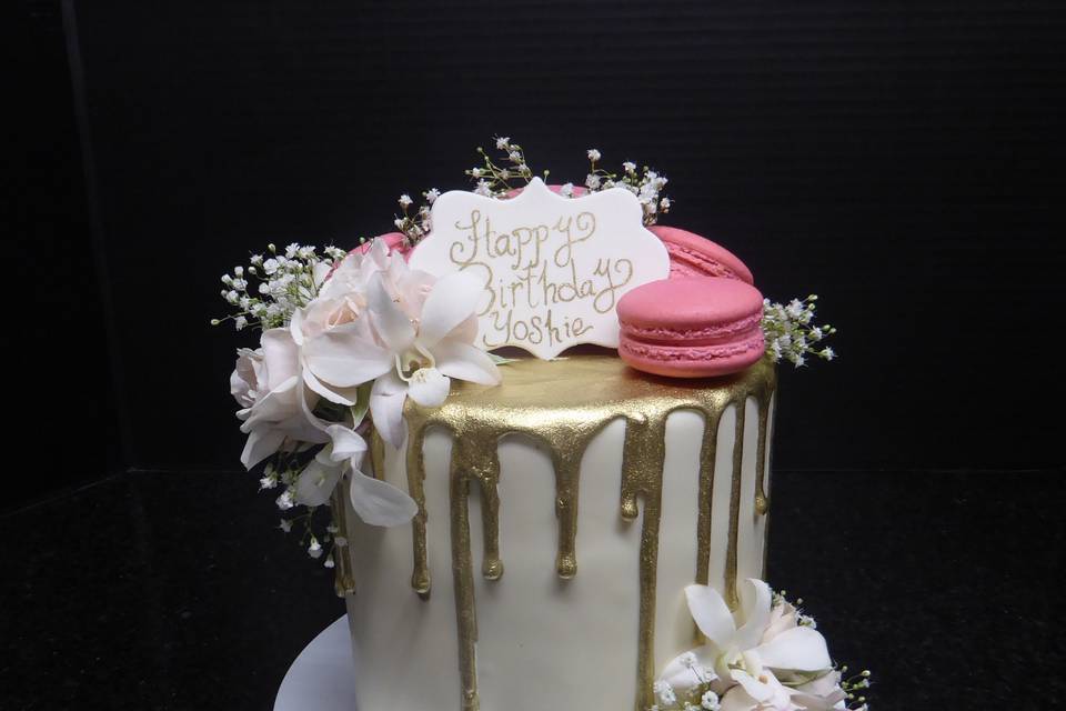 Gold drip birthday dake with french macarons and orchids