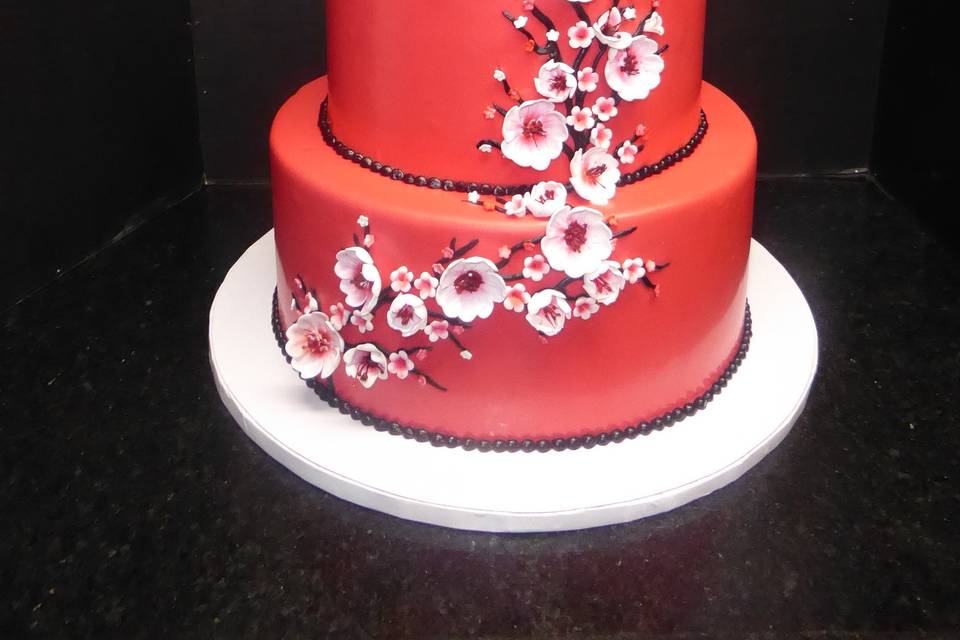 3 tier red fondant with sugar cherry blossoms