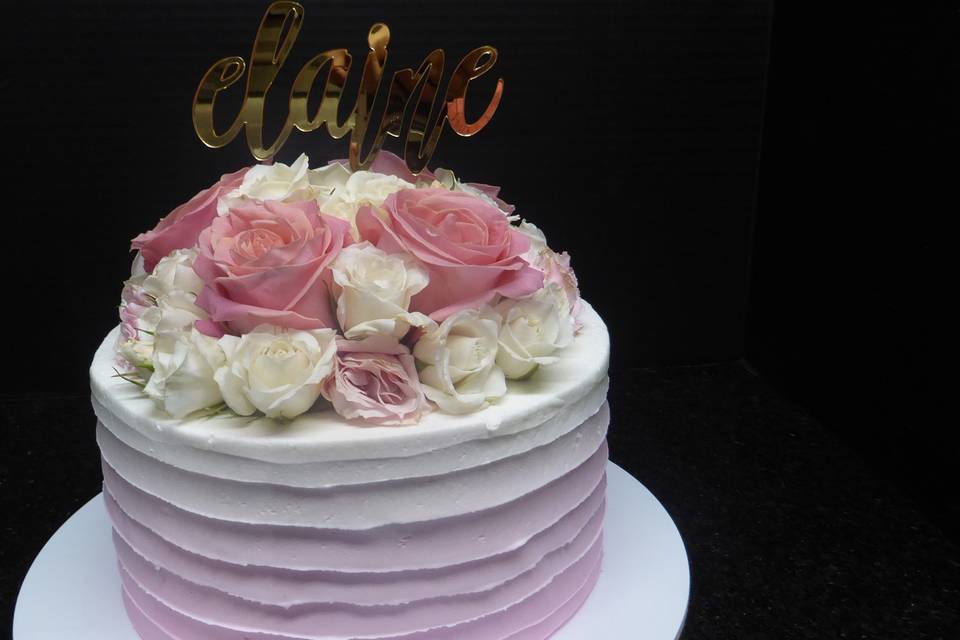 One tier Ombre light pink with horizontal spatula marks and fresh roses