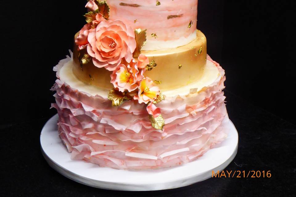 Five tier Fondant cake with blush pinks, white, and gold accents, sugar roses and flower accents.
