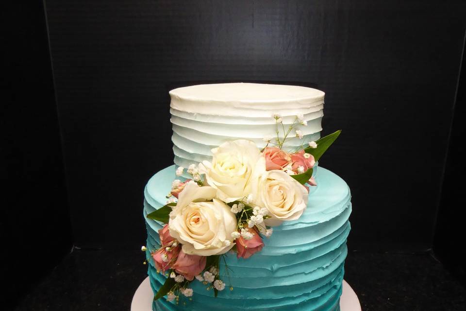 2 tier blue Ombre cake with fresh flower 