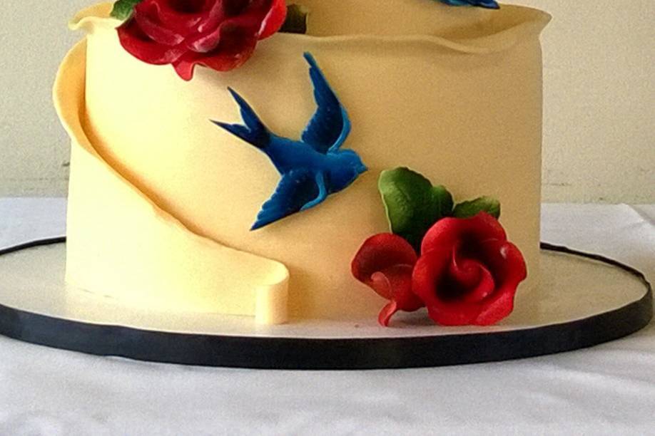Romantic 3 tier vintage tatoo art cake wrapped in white modeling chocolate