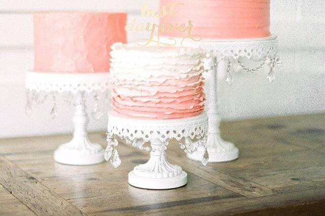 Trio of blush pink single tier cakes, with butter cream and fondant finishes