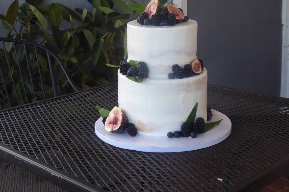2 tier semi naked cake with figs, blackberries, and some greenery