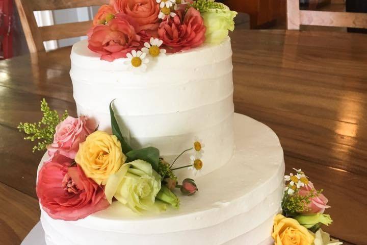 2 tier with horizontal buttercream finish, fresh roses and Mr. and Mrs. cake topper