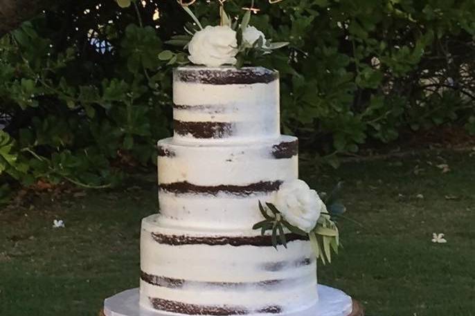 Semi naked cake chocolate cake with fresh white roses