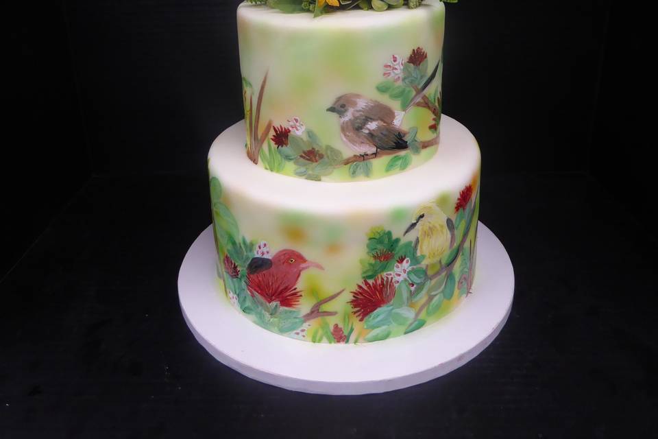 2 tier fondant Hand painted Hawaiian local birds and plants with local hawaiian flower and plant topper