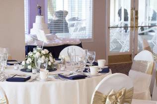 White and gold table and chair setup