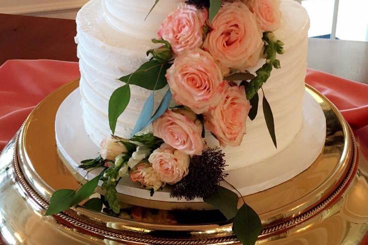 White wedding cake with flowers