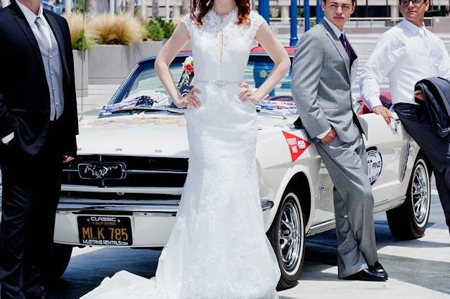 Wedding party with vintage car