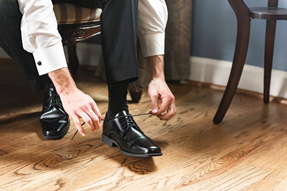 Lacing up his shoes