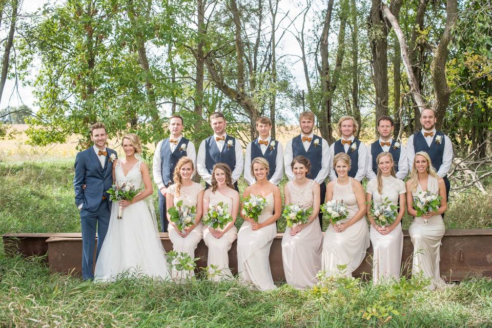 The couple with the bridesmaids and groomsmen