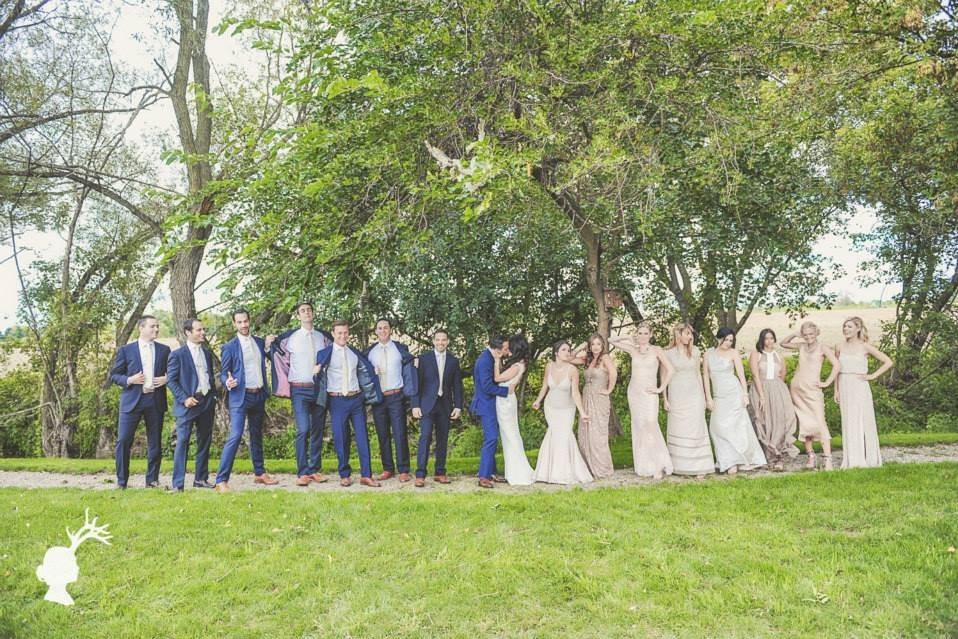 The couple with the bridesmaids and groomsmen