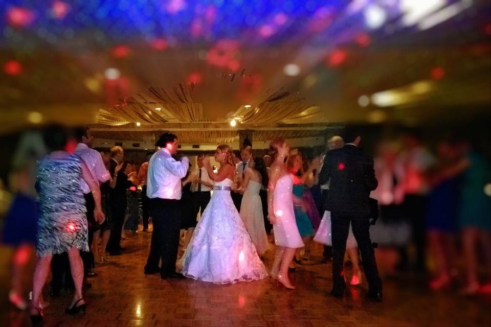 Couple dancing with guests