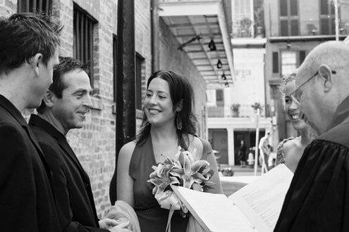 Chaplain Schwehm and couple in Cabildo Alley.