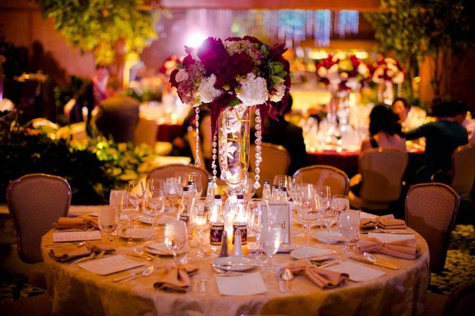 Table setup with candle and floral centerpiece