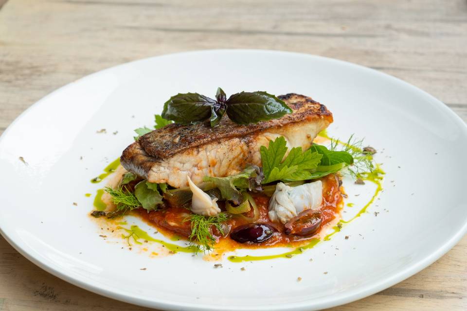 Sea bass with tomatoes and capers