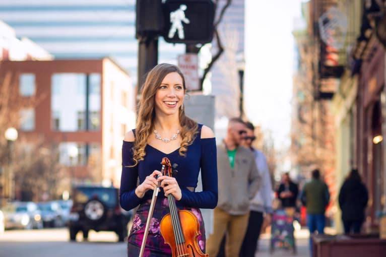 Walking across the street with the violin