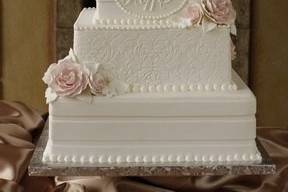 Four layered white wedding cake