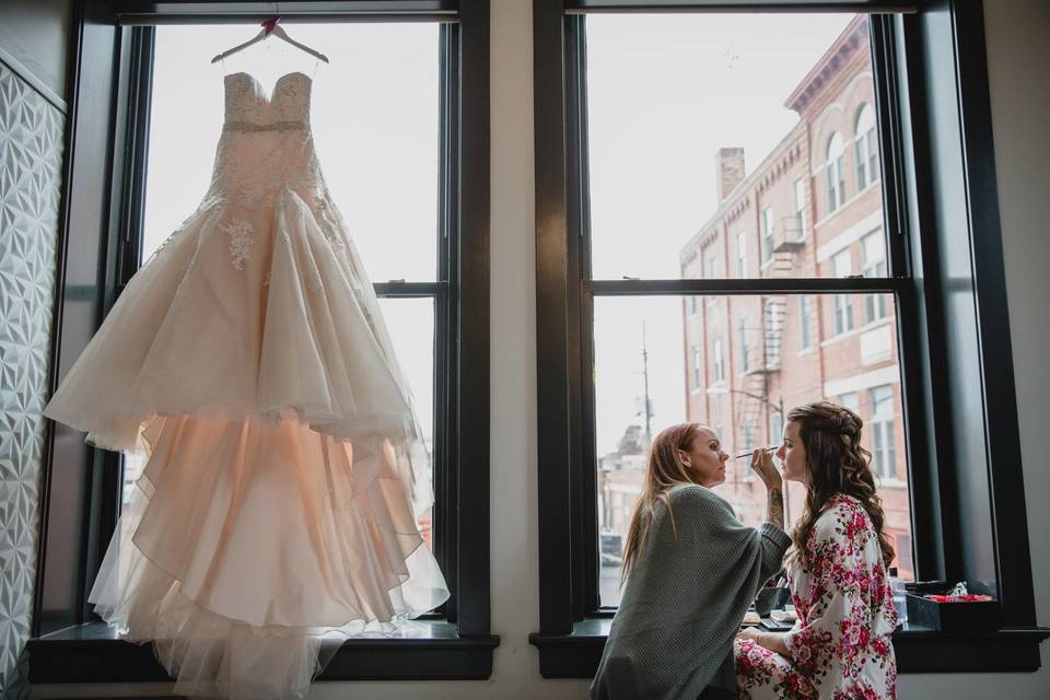 Wedding dress hung by the window