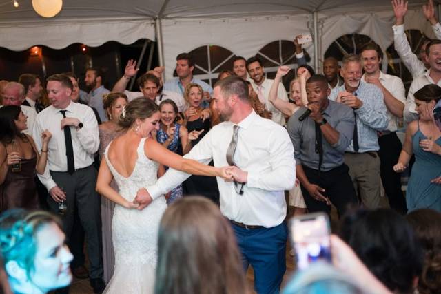 Bride and groom dancing as gue