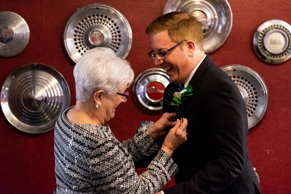 Groom & mother getting ready