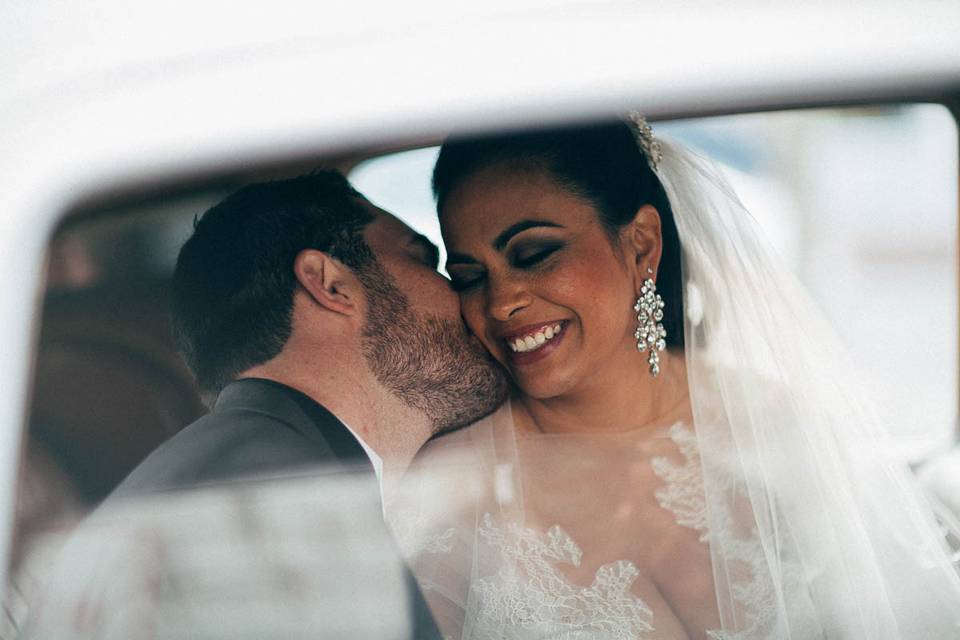 The new groom steals a kiss as the newly weds drive off after a wedding I will never forget.