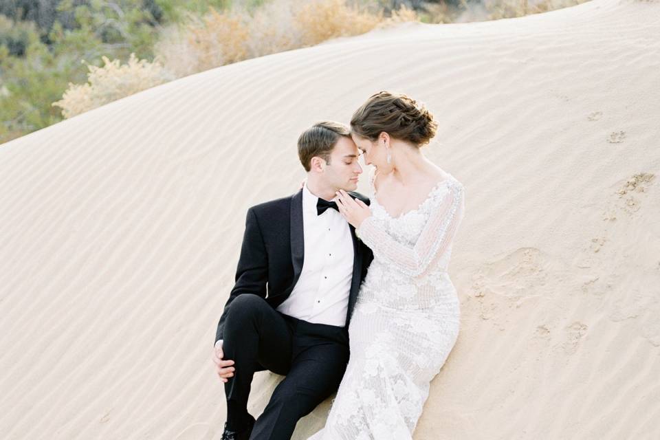Couple embrace in the sand
