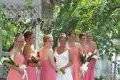 Beautiful coral beach wedding and with hair styles to with stand beach breeze