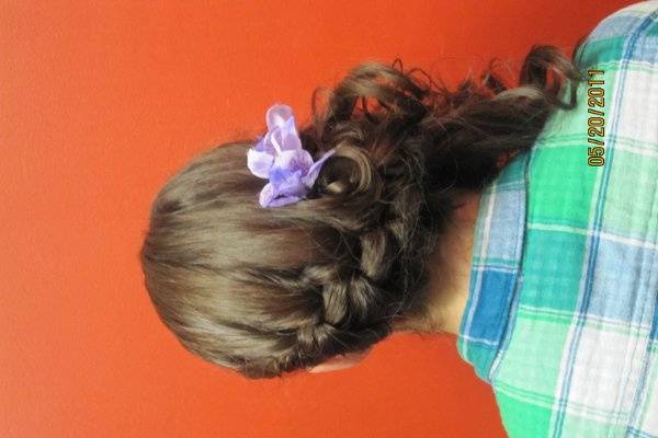 lose side french braid breaking out into curls.  Casual lavender prom dress deserves a casual hair style